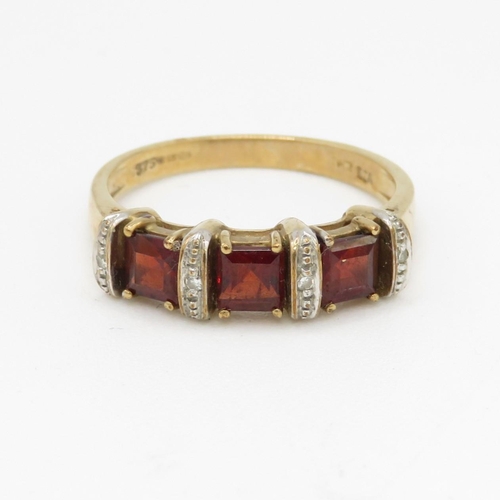 161 - 9ct gold garnet & diamond dress ring (2.8g) Size P