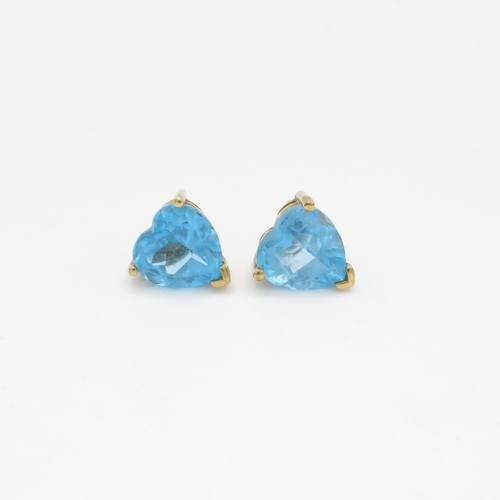 38 - 9ct gold heart cut blue topaz stud earrings (3.1g)