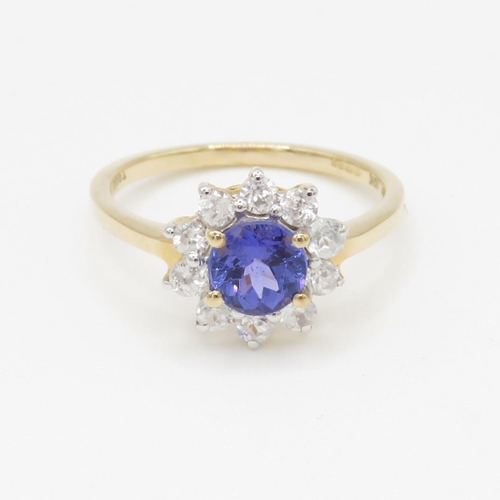 48 - 9ct gold tanzanite and white zircon halo set ring (2.2g) Size O