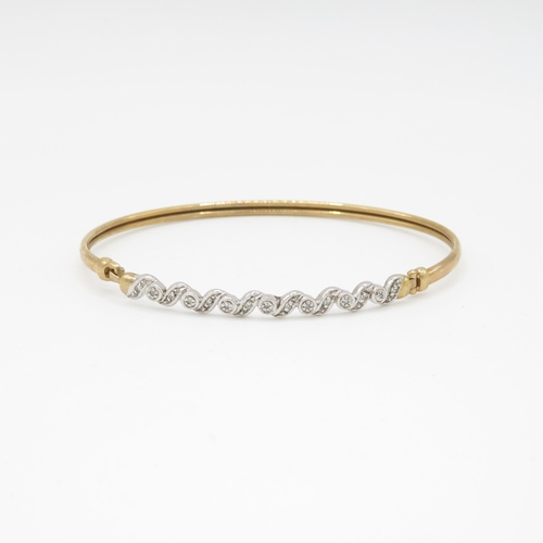 7 - 9ct gold and diamond bangle (5.1g)