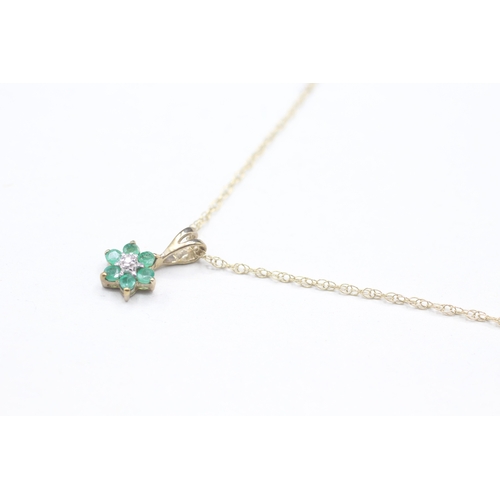 107 - 9ct gold emerald and diamond pendant on chain (1g)