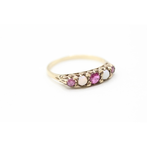 112 - 9ct gold opal and ruby ring (1.6g) Size P