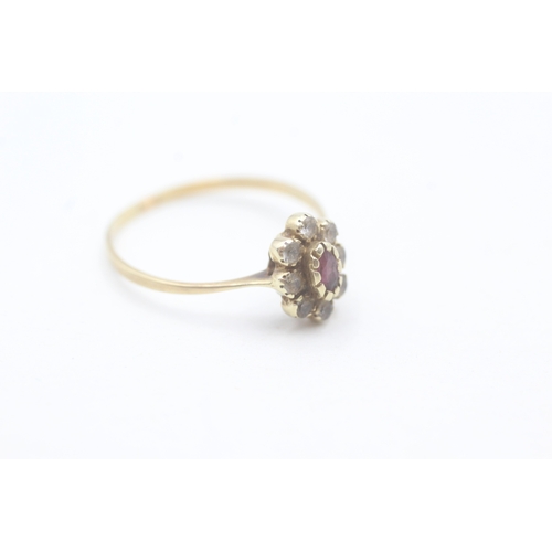 12 - 15ct gold ruby and white gemstone halo set ring (1.6g) Size P