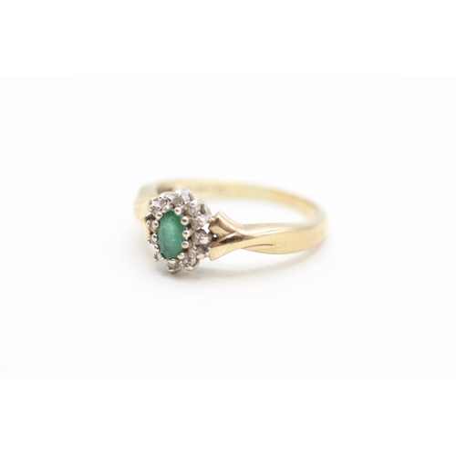 128 - 9ct gold emerald and diamond halo set ring (2.4g)