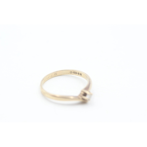 131 - 9ct gold and single diamond ring (1.2g) Size K