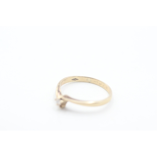 131 - 9ct gold and single diamond ring (1.2g) Size K