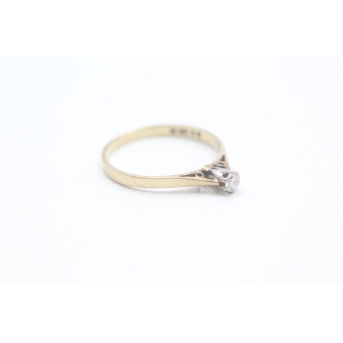 142 - 9ct gold solitaire diamond ring (0.9g) Size J