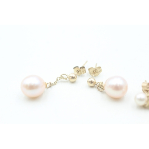 153 - 2 x 9ct gold cultured pearl stud and drop earrings (2.6g)