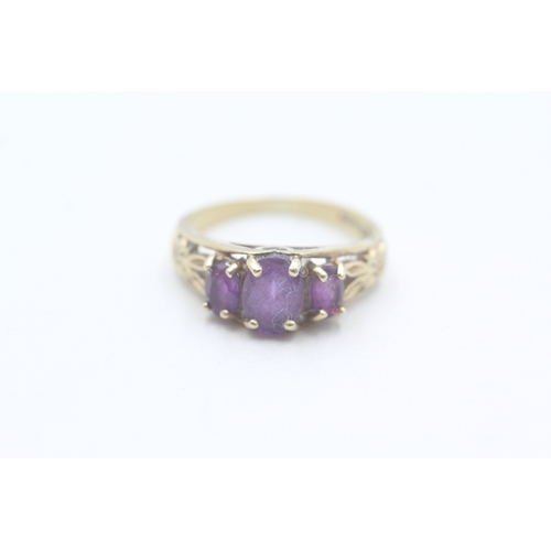 159 - 9ct gold amethyst dress ring with patterned shoulders (2.2g) Size K