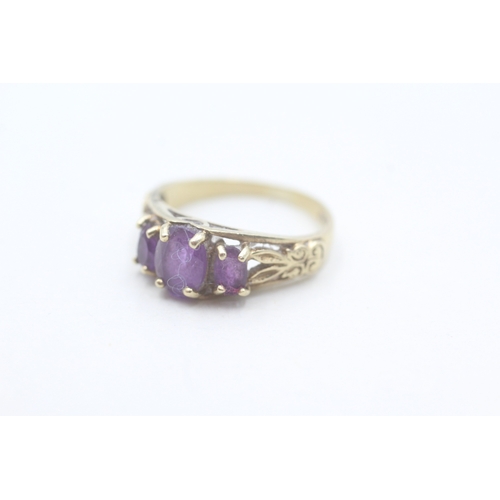 159 - 9ct gold amethyst dress ring with patterned shoulders (2.2g) Size K