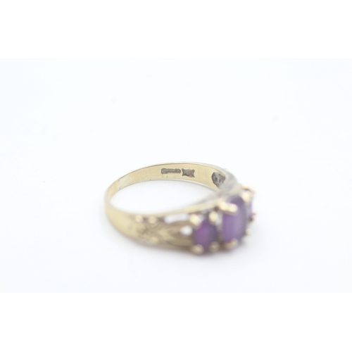 159 - 9ct gold amethyst dress ring with patterned shoulders (2.2g) Size K