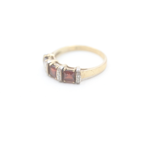 161 - 9ct gold garnet & diamond dress ring (2.8g) Size P