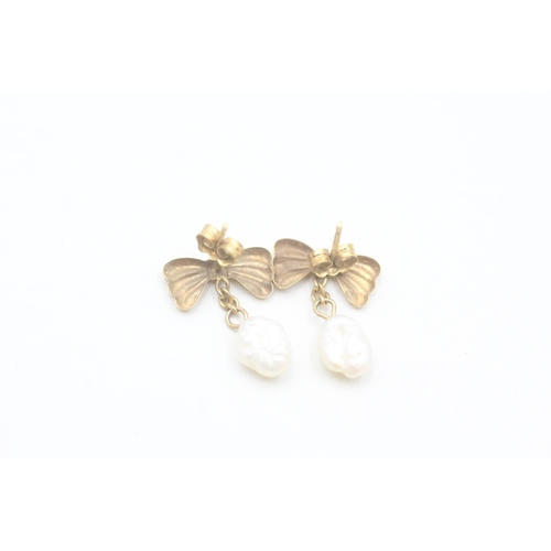 177 - 9ct gold rice pearl drop stud earrings (0.9g)