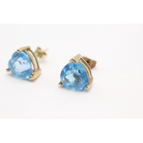 38 - 9ct gold heart cut blue topaz stud earrings (3.1g)