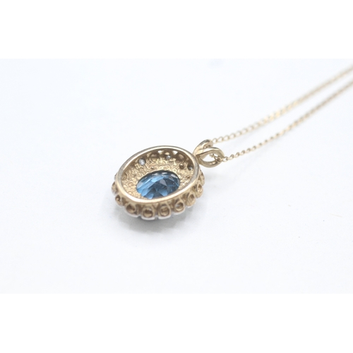 45 - 9ct gold topaz and diamond pendant on chain (2.8g)