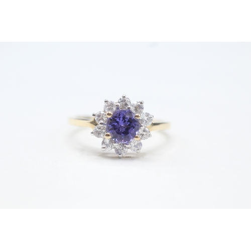 48 - 9ct gold tanzanite and white zircon halo set ring (2.2g) Size O