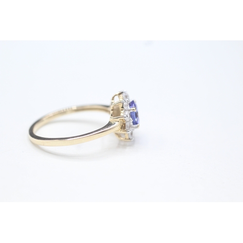 48 - 9ct gold tanzanite and white zircon halo set ring (2.2g) Size O