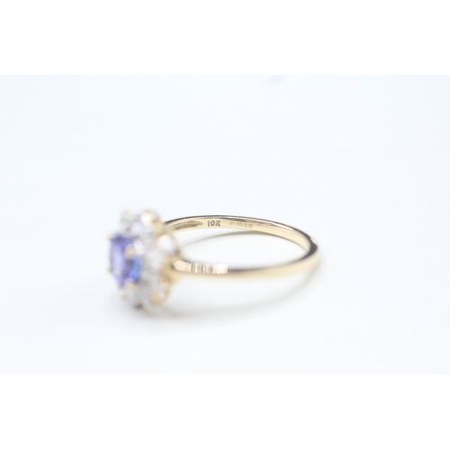 48 - 9ct gold tanzanite and white zircon halo set ring (2.2g) Size O