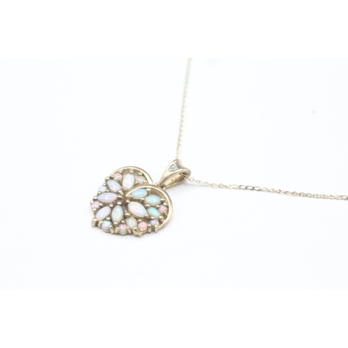 49 - 9ct gold opal and diamond pendant on chain (2.7g)