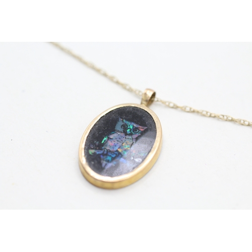 59 - 9ct gold opal triplet pendant on chain (1.4g)