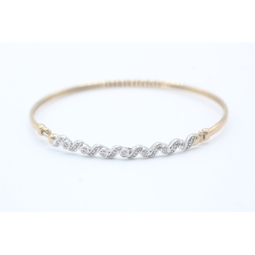 7 - 9ct gold and diamond bangle (5.1g)