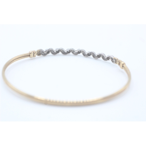 7 - 9ct gold and diamond bangle (5.1g)