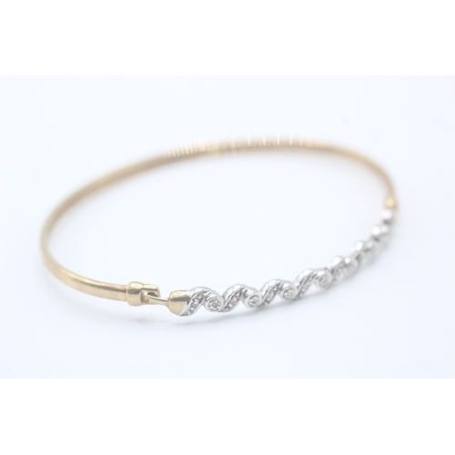 7 - 9ct gold and diamond bangle (5.1g)