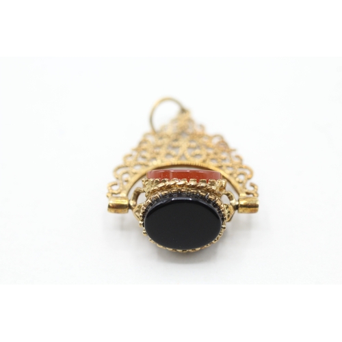 86 - 9ct gold onyx, blood stone and carnelian spinner fob (3.4g)