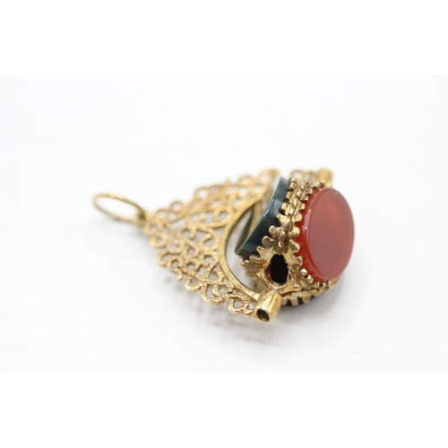 86 - 9ct gold onyx, blood stone and carnelian spinner fob (3.4g)