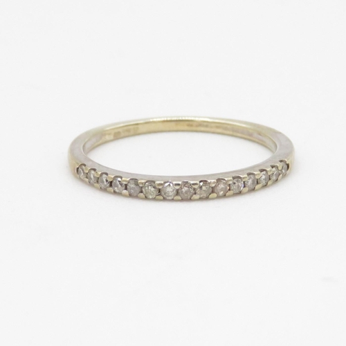 222 - 9ct gold and diamond row set ring (1.2g) Size L