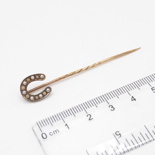 232 - 15ct gold antique seed pearl horseshoe stick pin with a 9ct gold pin (1.9g)