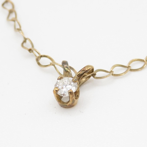 242 - 9ct gold single diamond pendant on chain (1.1g)