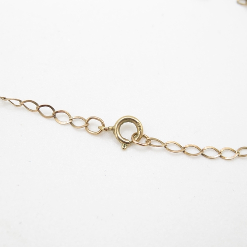 242 - 9ct gold single diamond pendant on chain (1.1g)