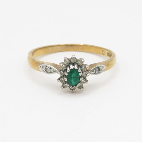 114 - 9ct gold emerald and diamond halo ring (1.8g) Size P