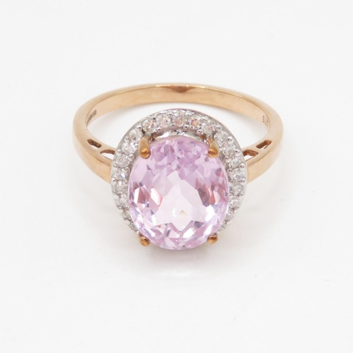 123 - 9ct gold kunzite and diamond halo set ring (4.3g) Size T