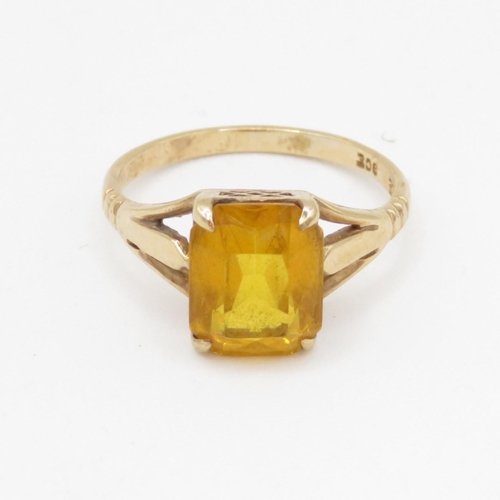 145 - 9ct gold orange paste single stone ring (2.9g) Size O