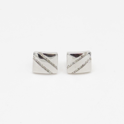 64 - 9ct gold and diamond stud earrings (2.3g)