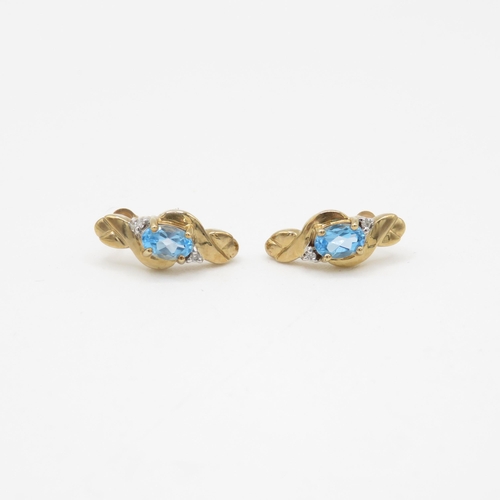 81 - 9ct gold blue topaz and diamond stud earrings (2.7g)