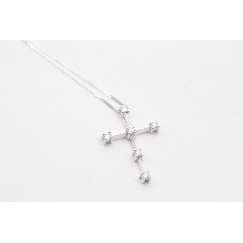 101 - 9ct gold diamond cross on chain (1.7g)