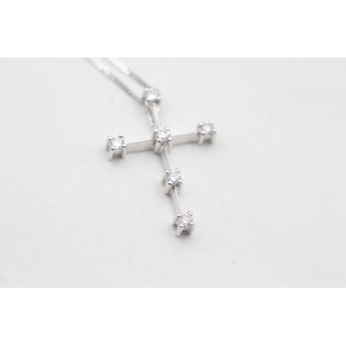 101 - 9ct gold diamond cross on chain (1.7g)