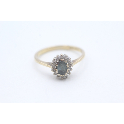 106 - 9ct gold blue topaz and diamond halo set ring (2.2g) Size P