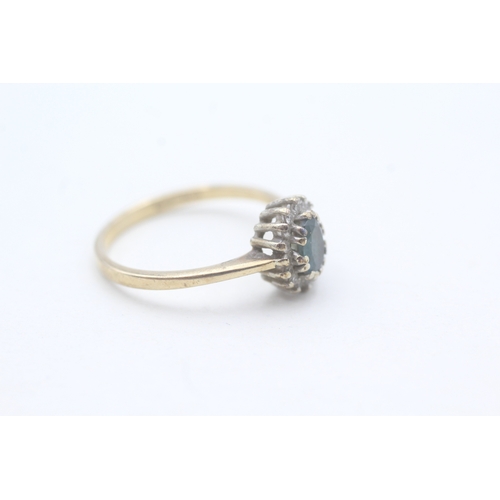 106 - 9ct gold blue topaz and diamond halo set ring (2.2g) Size P