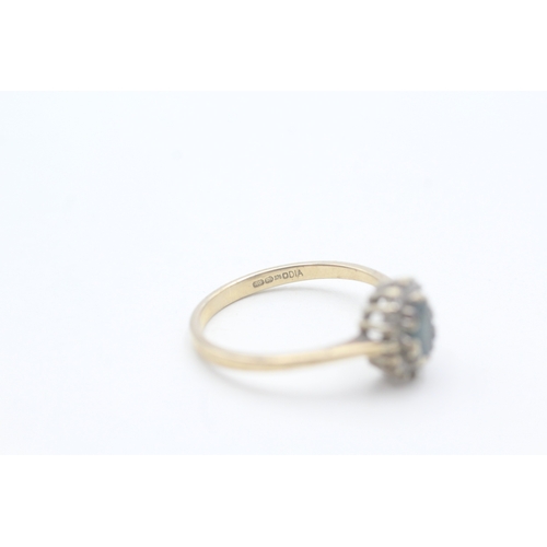 106 - 9ct gold blue topaz and diamond halo set ring (2.2g) Size P