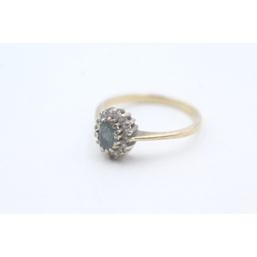 106 - 9ct gold blue topaz and diamond halo set ring (2.2g) Size P