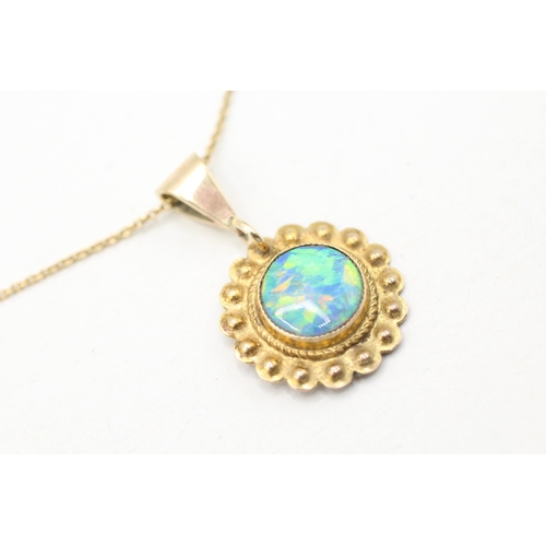 112 - 9ct gold opal framed pendant on chain (2.4g)