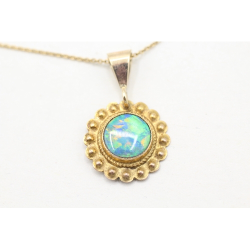 112 - 9ct gold opal framed pendant on chain (2.4g)