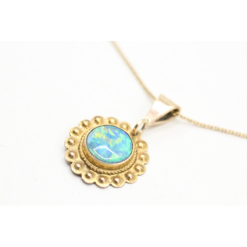 112 - 9ct gold opal framed pendant on chain (2.4g)