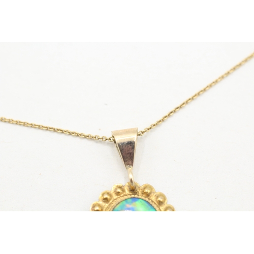 112 - 9ct gold opal framed pendant on chain (2.4g)