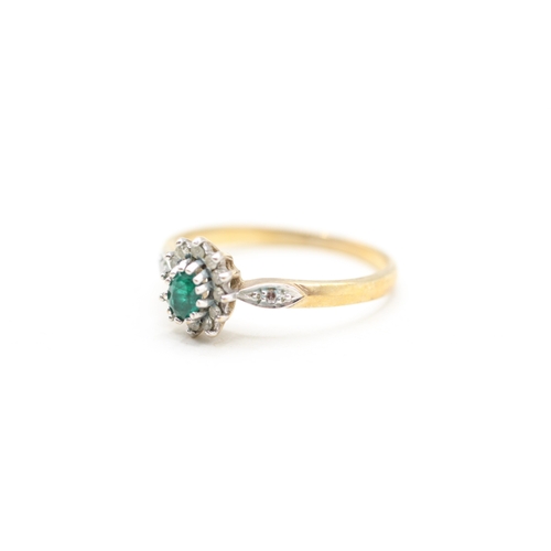 114 - 9ct gold emerald and diamond halo ring (1.8g) Size P