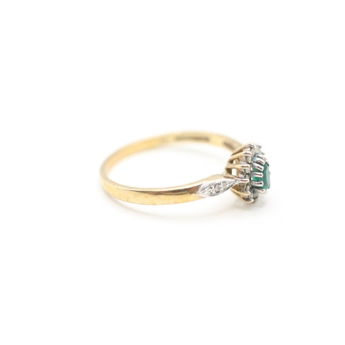 114 - 9ct gold emerald and diamond halo ring (1.8g) Size P